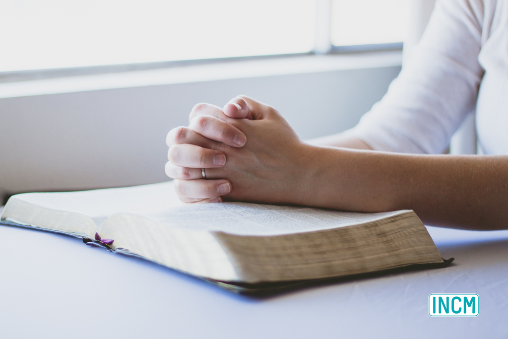 Folded, praying hands